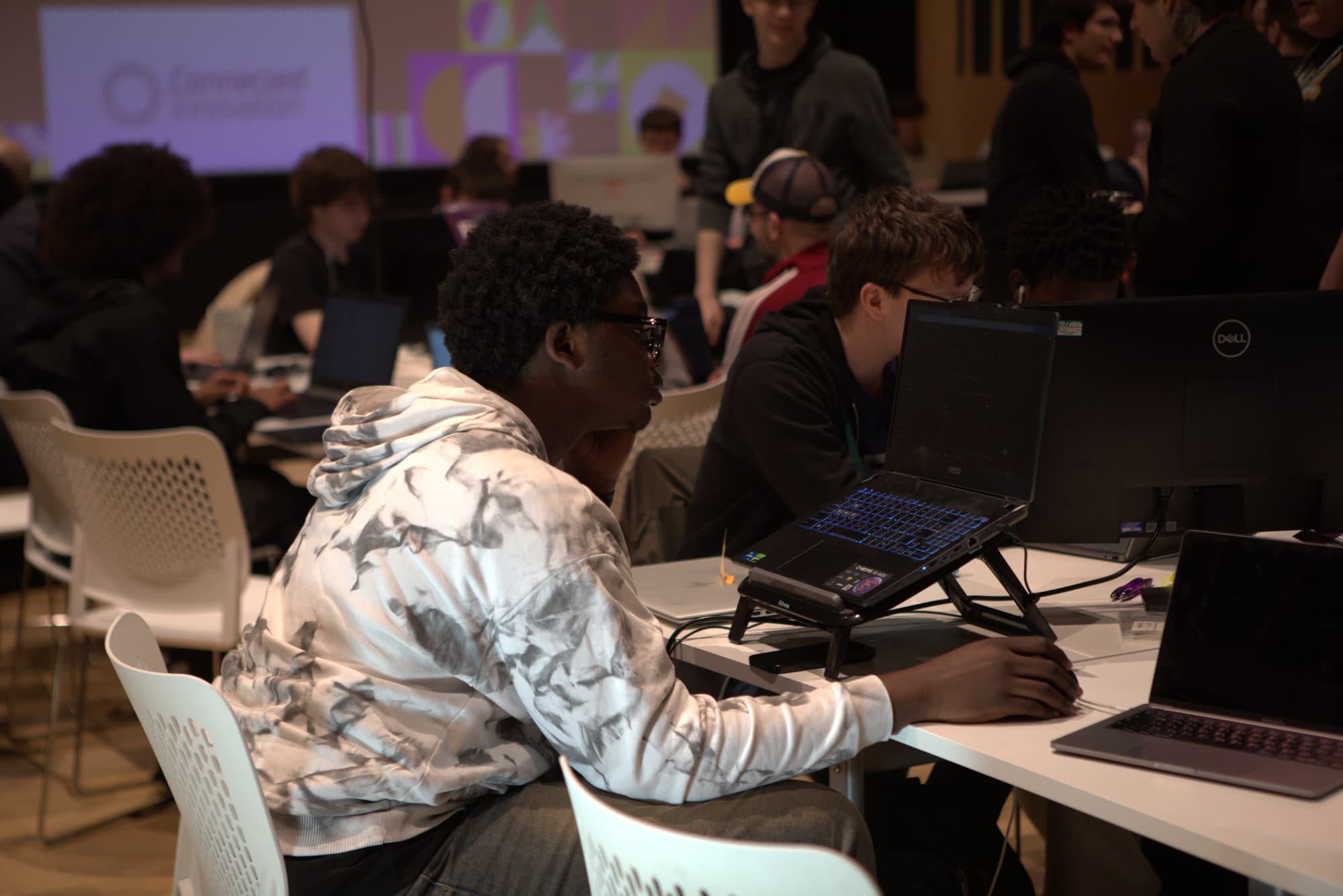 A participant concentrating on his code at HackEd Norwich 2026