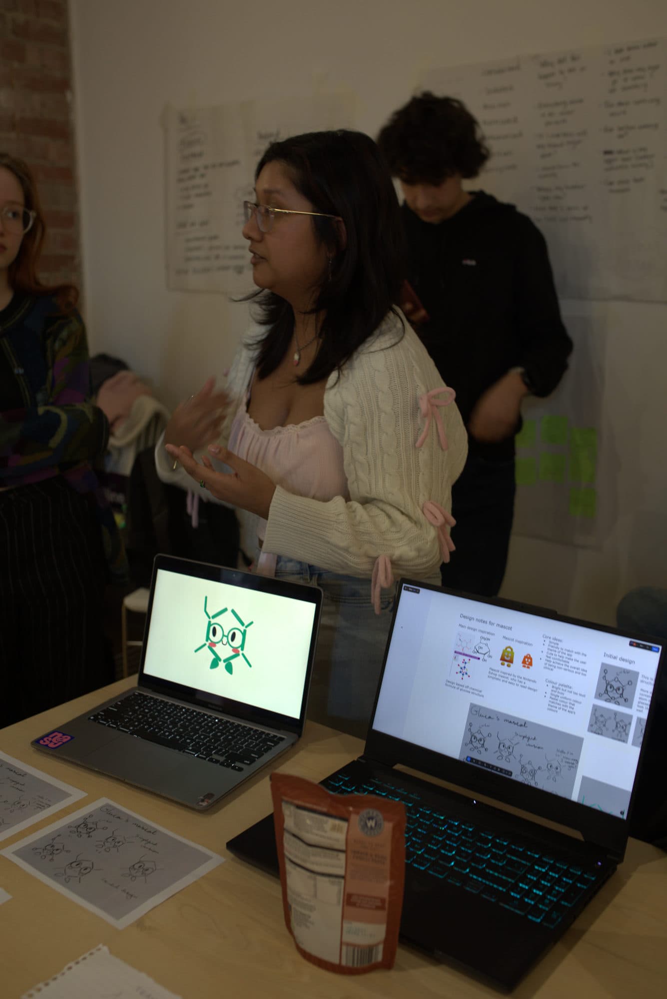 A student presenting her team's work at a project stand during the HackEd Norwich 2026 showcase