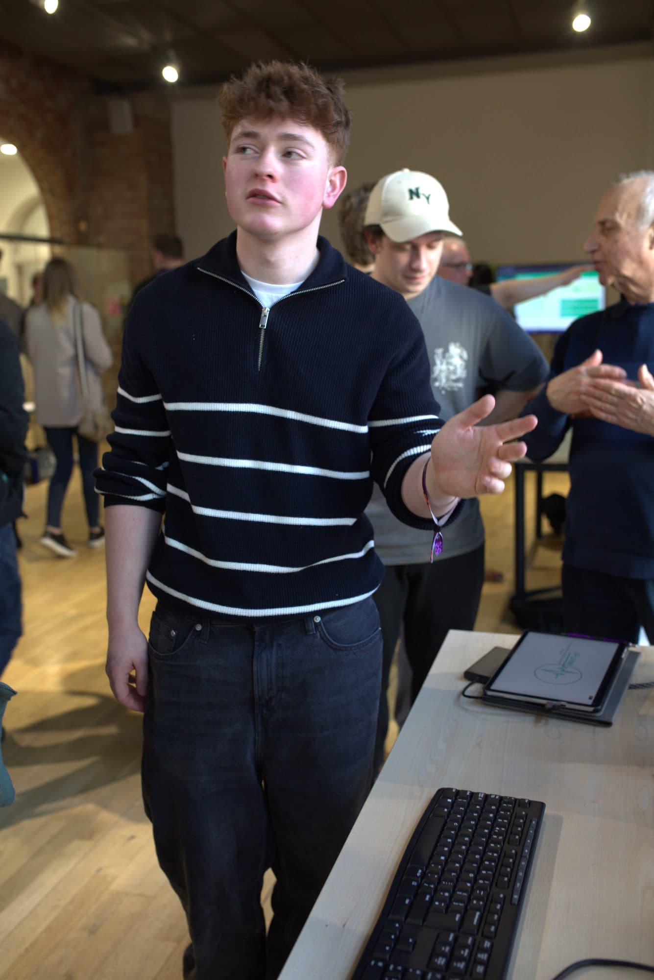 A student explaining his team's project at the HackEd Norwich 2026 showcase