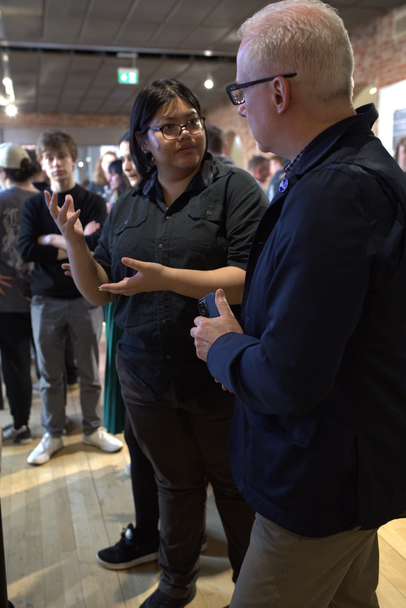 A student talking a judge through her project at the HackEd Norwich 2026 showcase