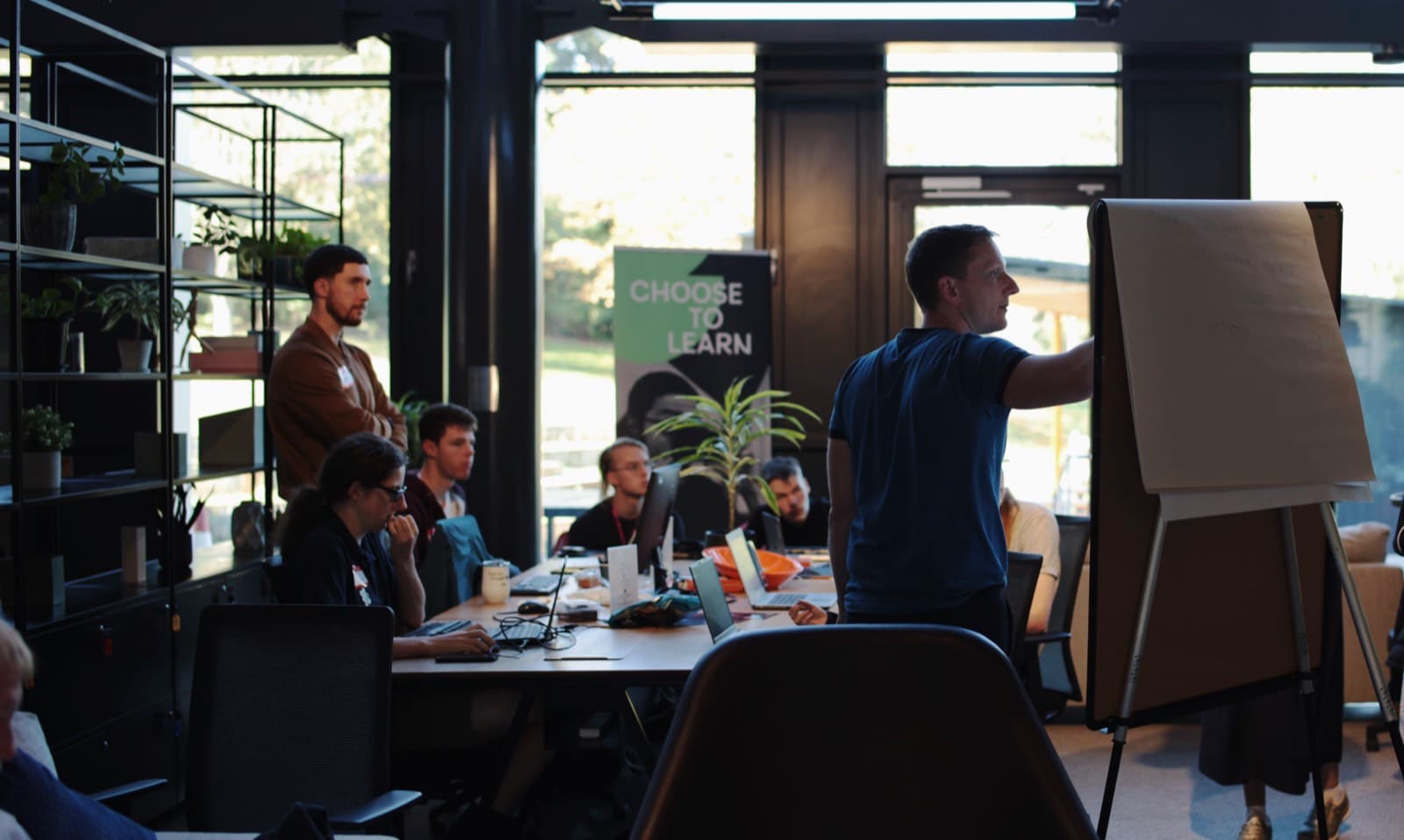 A UK business leader and team planning practical AI training to close the AI skills gap