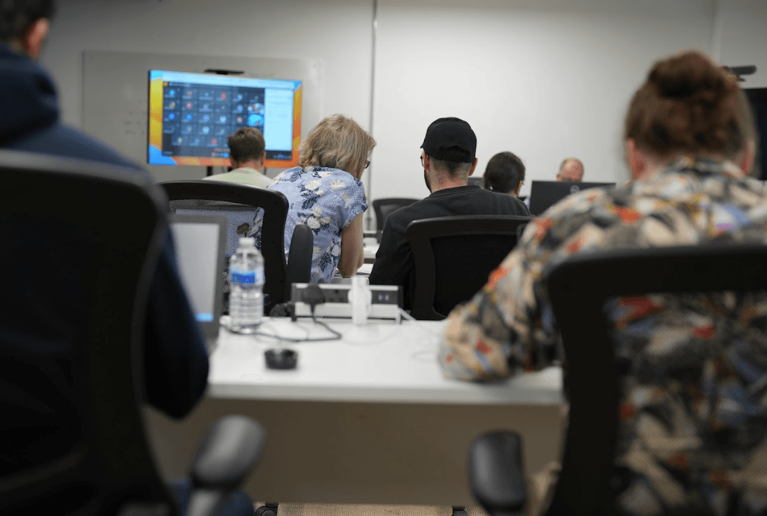 Front end developer building a responsive website layout on a widescreen monitor