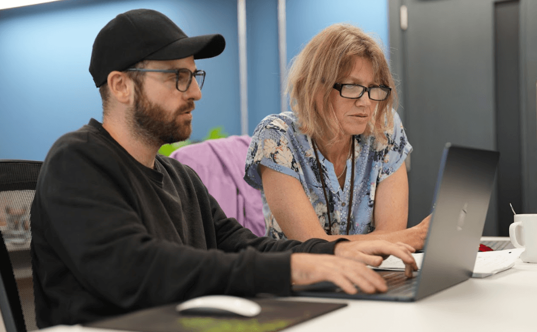 Adult learner working on code during a career change bootcamp