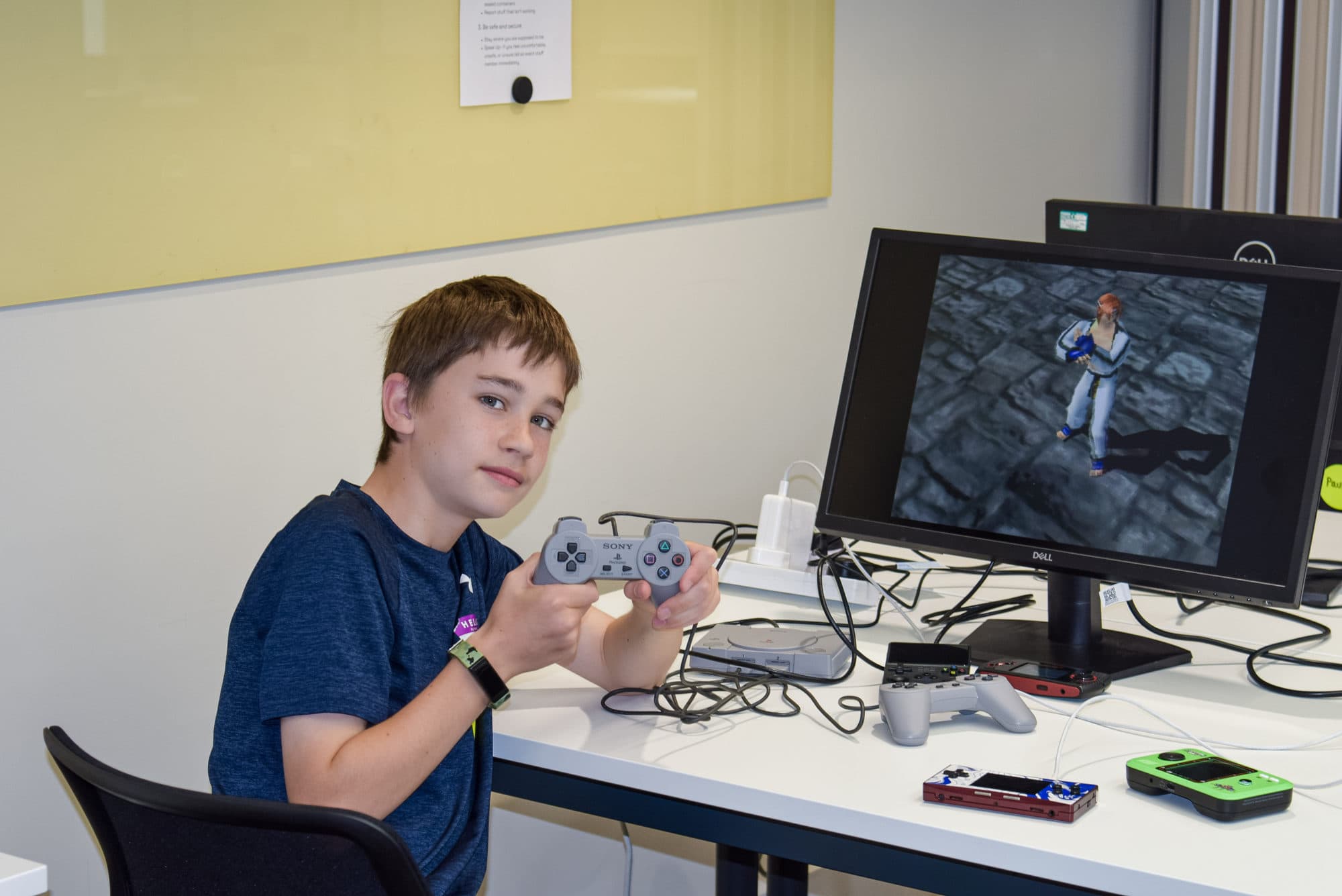 A participant playing a retro console at the Gaming Day